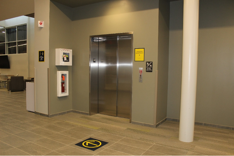 Please use the elevator to go to the first floor if entering on the second floor. The elevator is located on your right after you pass the department offices.